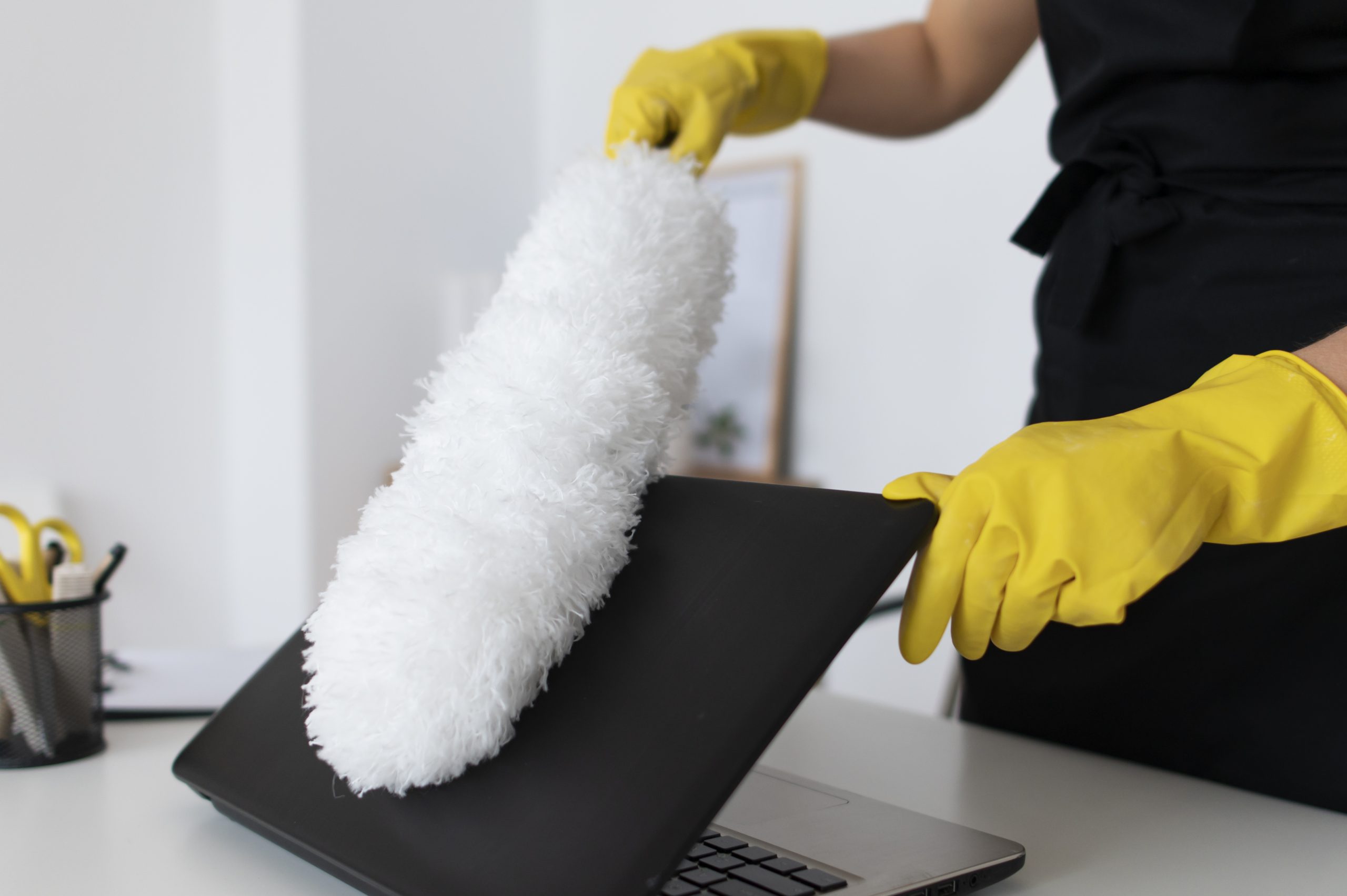 person taking care office cleaning scaled