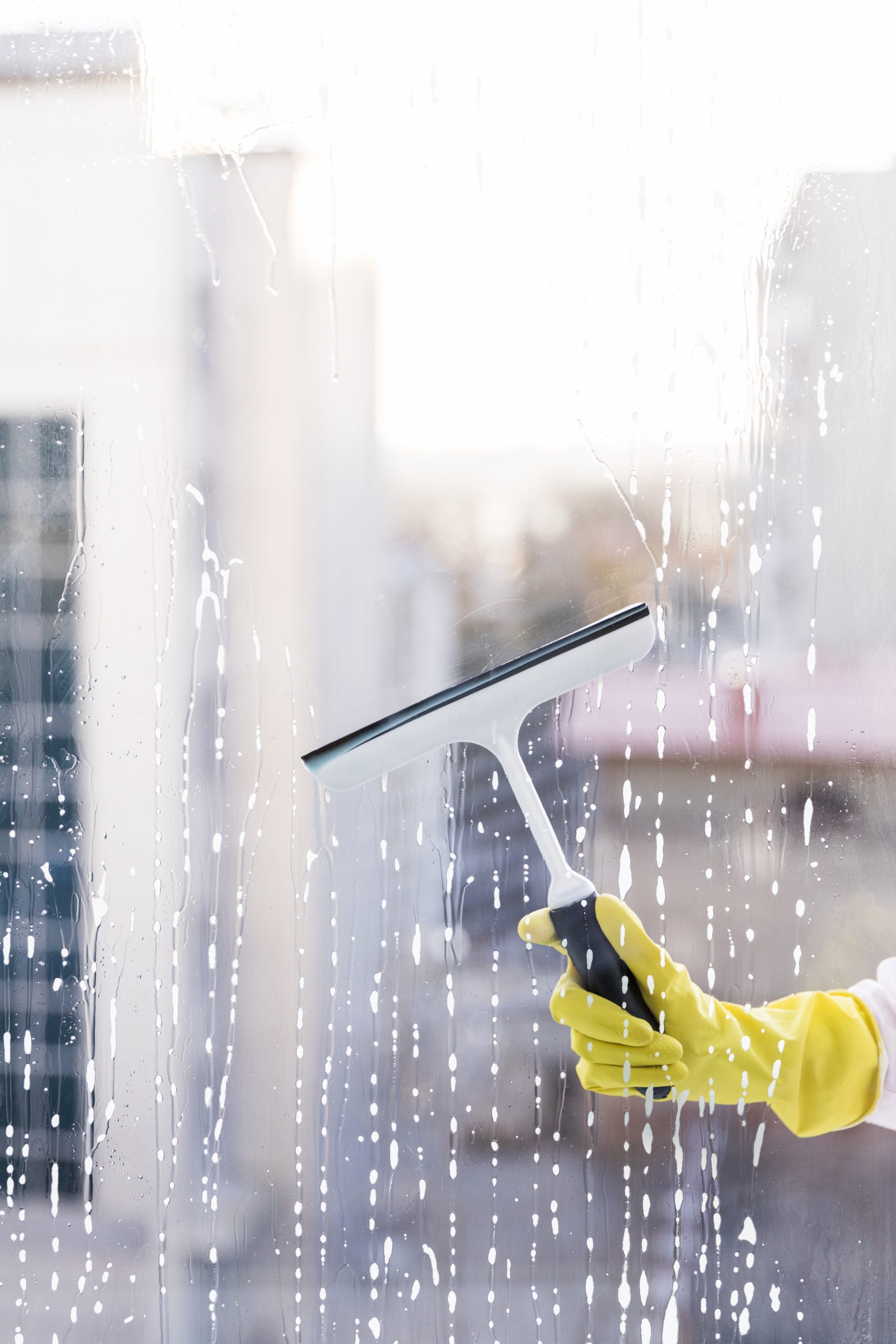 man cleaning window scaled